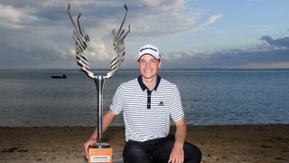 Rasmus Hojgaard poses with the AfrAsia Bank Mauritius Open trophy