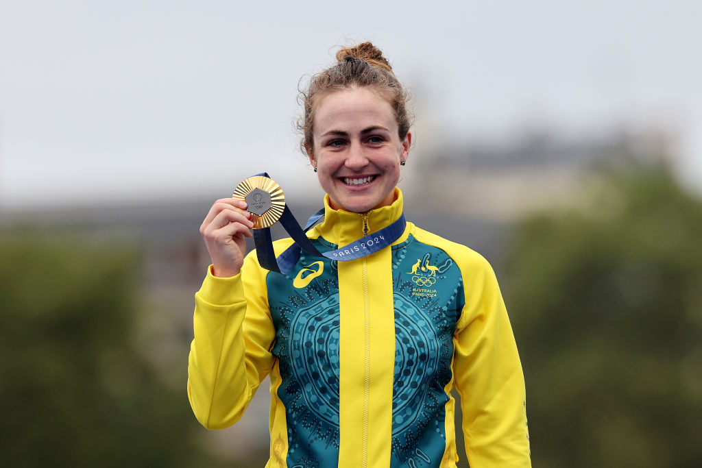 Gold medalist Grace Brown of Team Australia poses on the podium during the Women&#039;s Individual Time Trial on day one of the Olympic Games Paris 2024 at Pont Alexandre III on July 27, 2024 in Paris, France. (Photo by Tim de Waele/Getty Images)