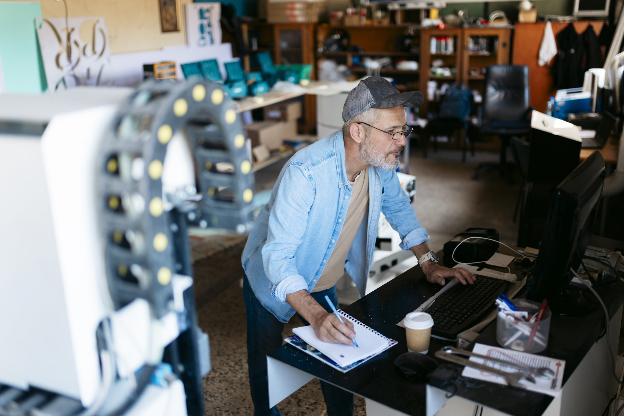 Older man working in a shop