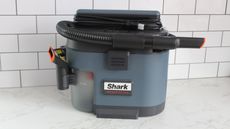 A Shark Messmaster Portable Wet/Dry Vacuum on a countertop