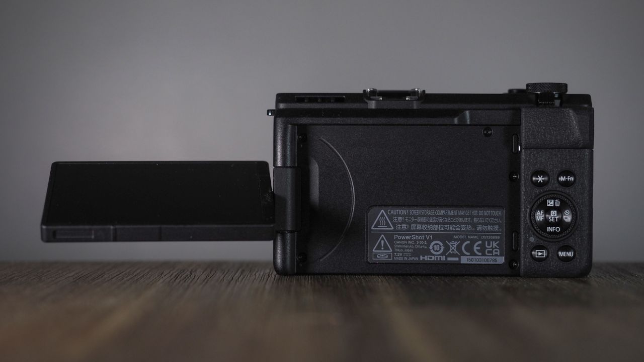 Canon PowerShot V1 on a wooden surface