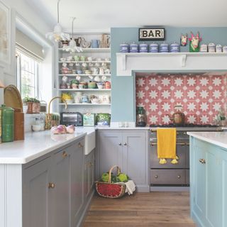 blue kitchen with pink and white star tile splashback