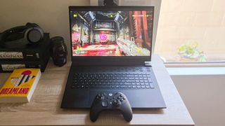 Alienware m18 review unit on desk running Doom Eternal