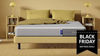The Casper Snug Mattress on a yellow bed frame placed in a yellow bedroom, with a Black Friday mattress deals badge overlaid on the image