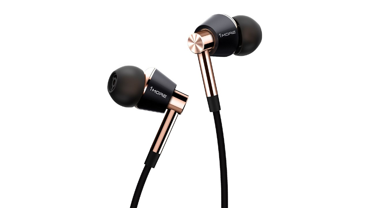 A pair of the 1More Triple Driver In-Ear Headphones in black and gold