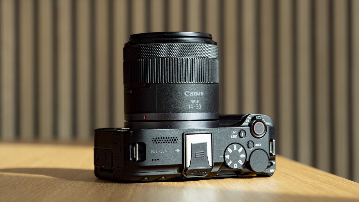 Topside of the Canon EOS R50 V on a wooden table