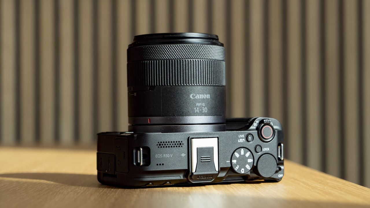Topside of the Canon EOS R50 V on a wooden table