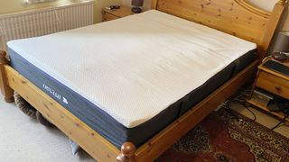 Nectar Premier Hybrid mattress on a bed frame in a room