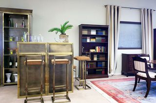 A mock room with furniture and book shelf