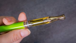 A vape pen with THC oil.
