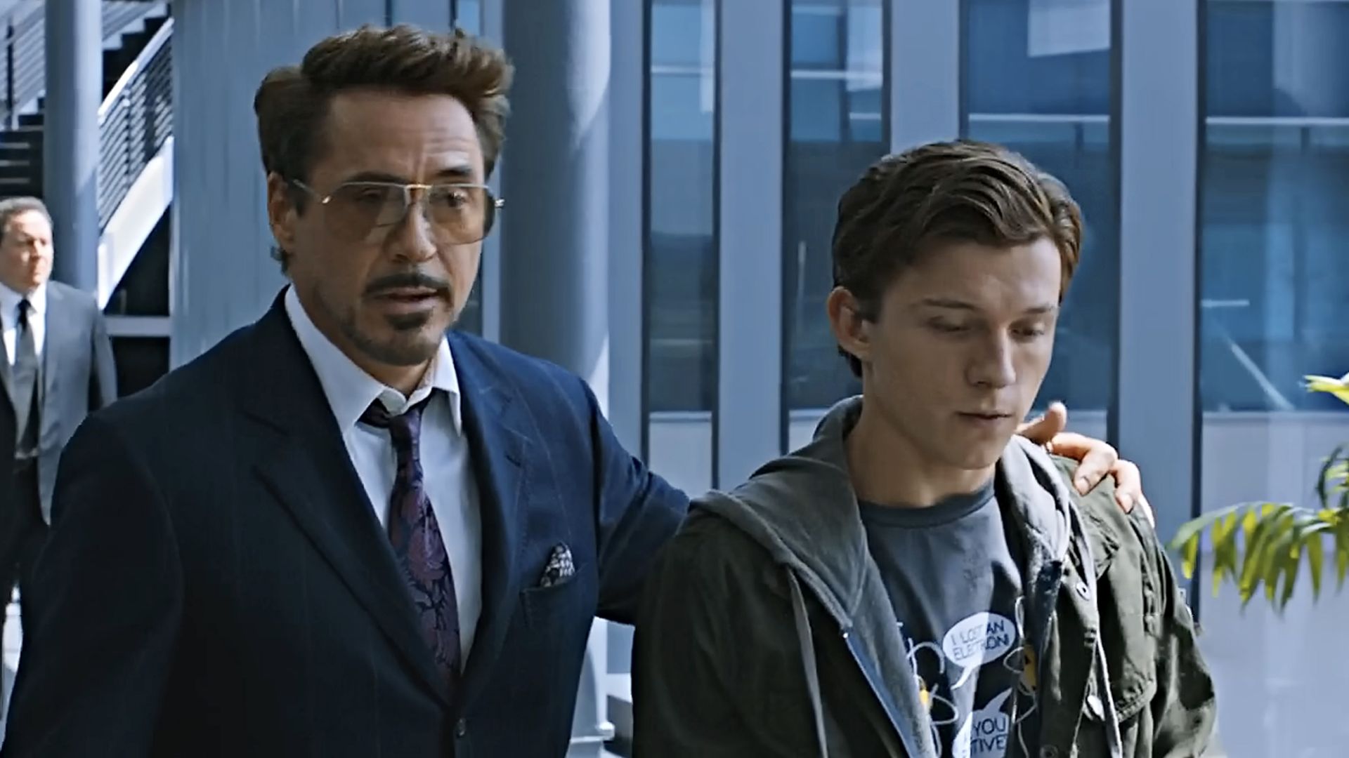 Tony Stark (Downey Jr) wraps his arm around a young Peter Parker, aka Spider-Man (Holland) in Spider-Man: Homecoming.