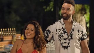 Nancy and Bartise smiling at an island happy hour in Love Is Blind season 3
