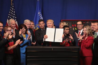 President Trump signs an executive order to try to bring jobs back to American workers and revamp the H-1B visa guest worker program.