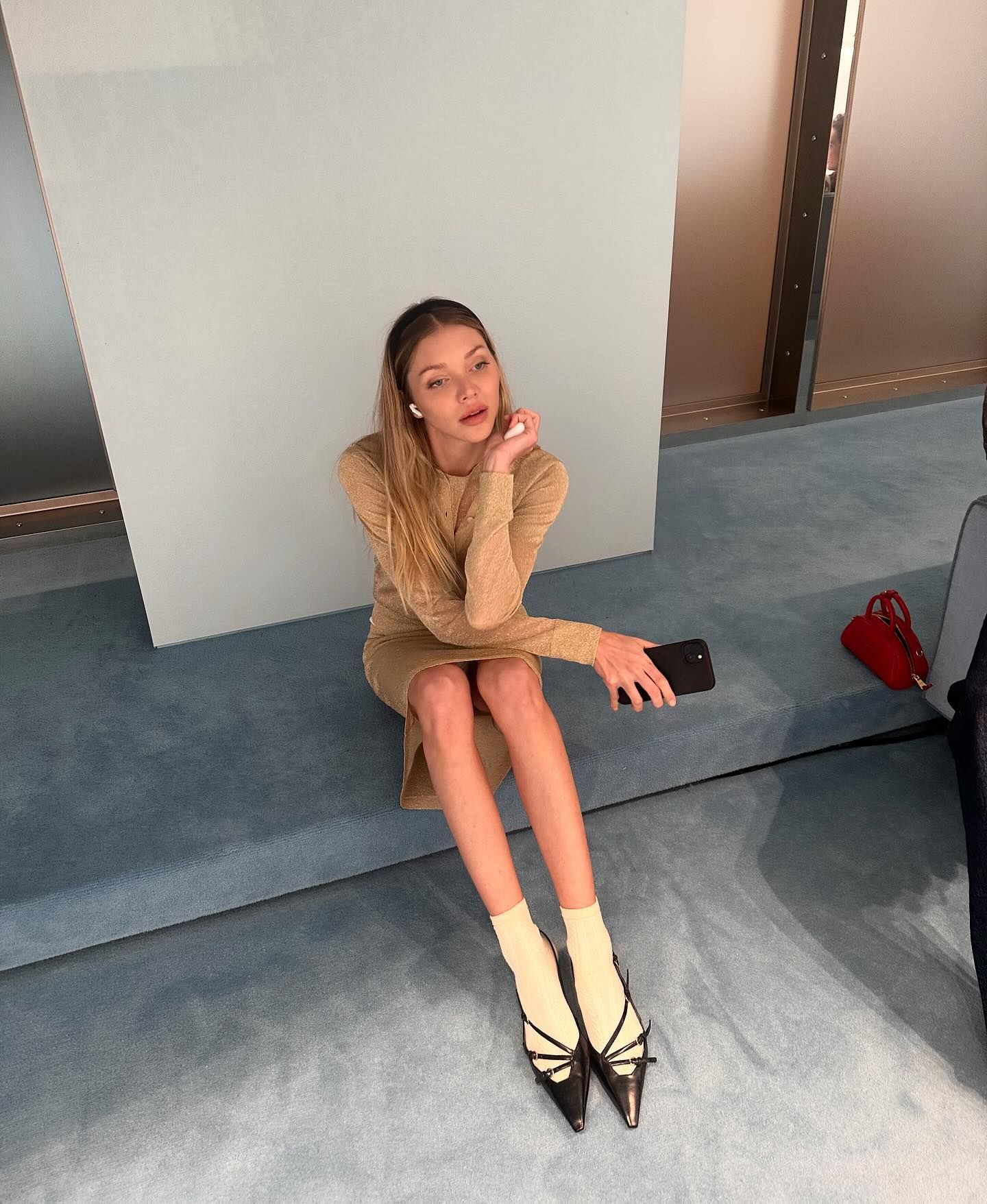 Jessie Andrews styles Miu Miu buckle slingbacks with yellow socks.
