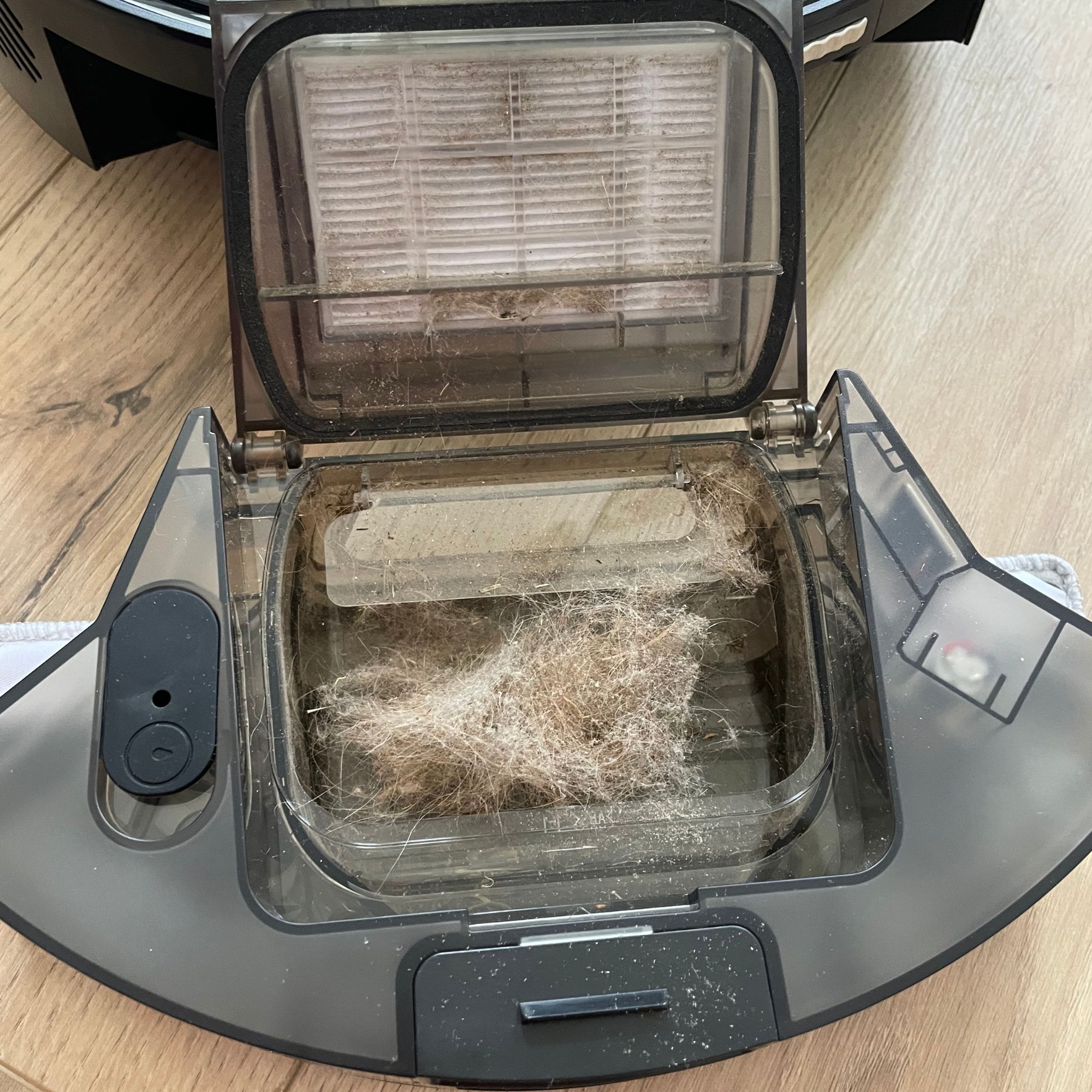 Hoover HG2 robot vacuum and mop dust canister with hair and dust in it
