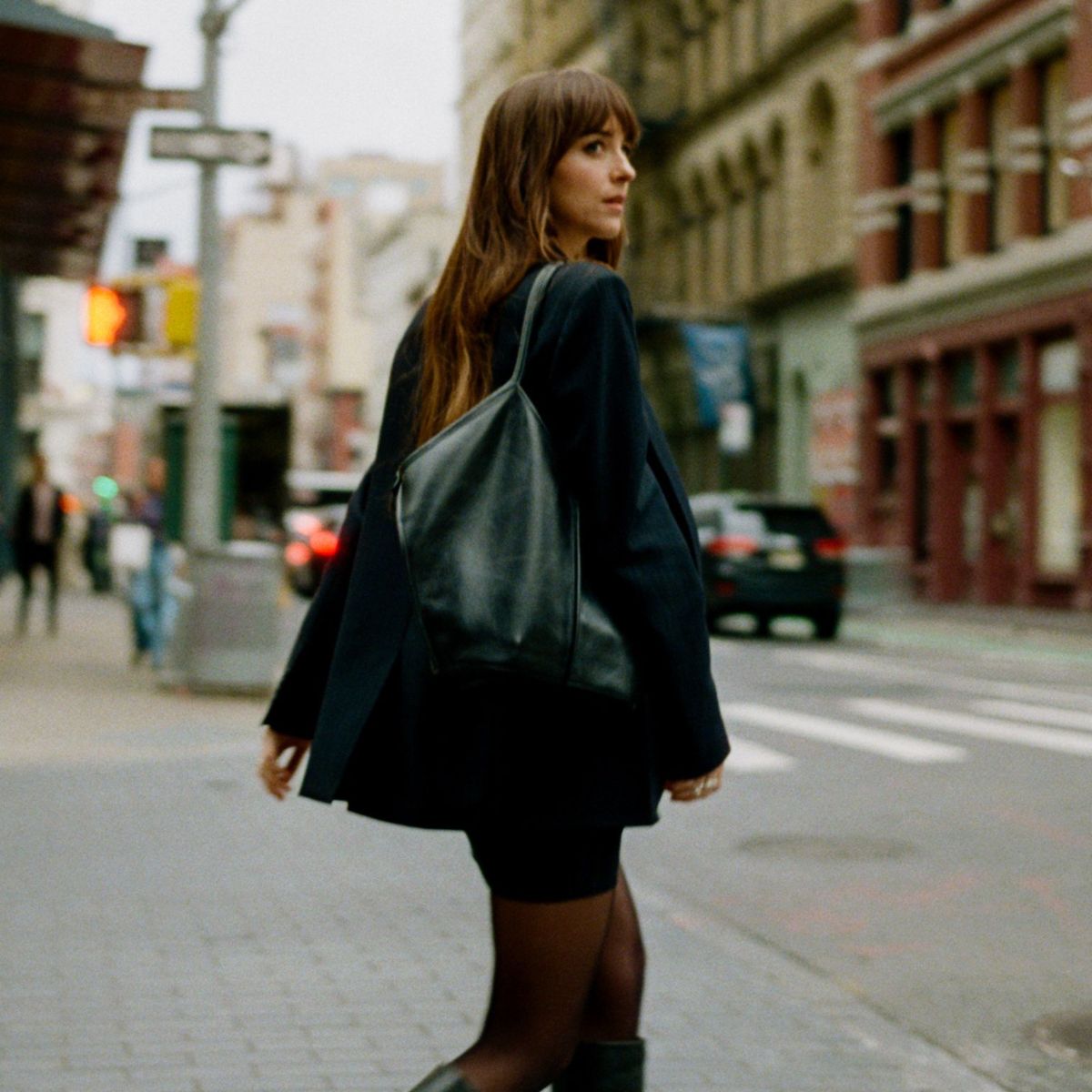 dakota johnson wearing blazer and skirt