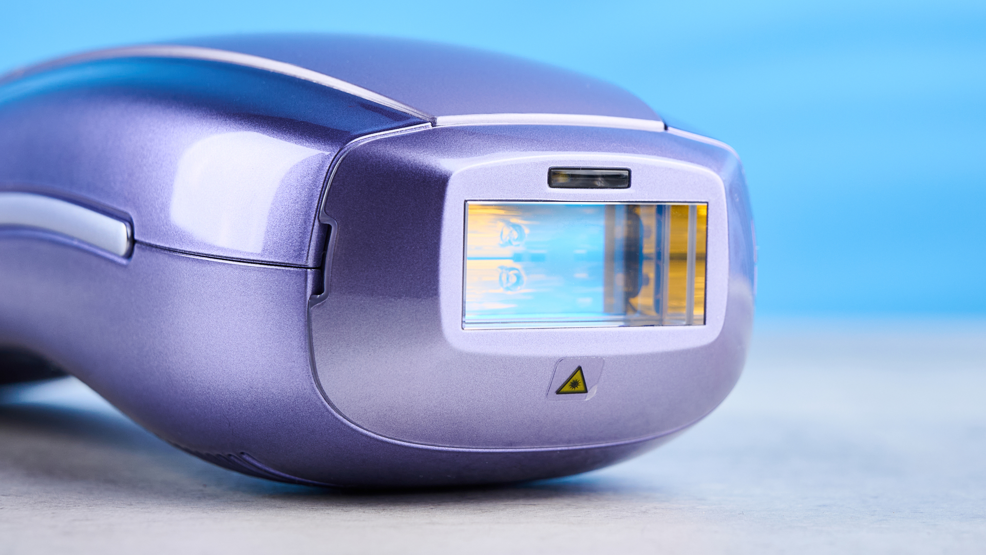 ULike Air 10 IPL machine photographed in front of a blue background.