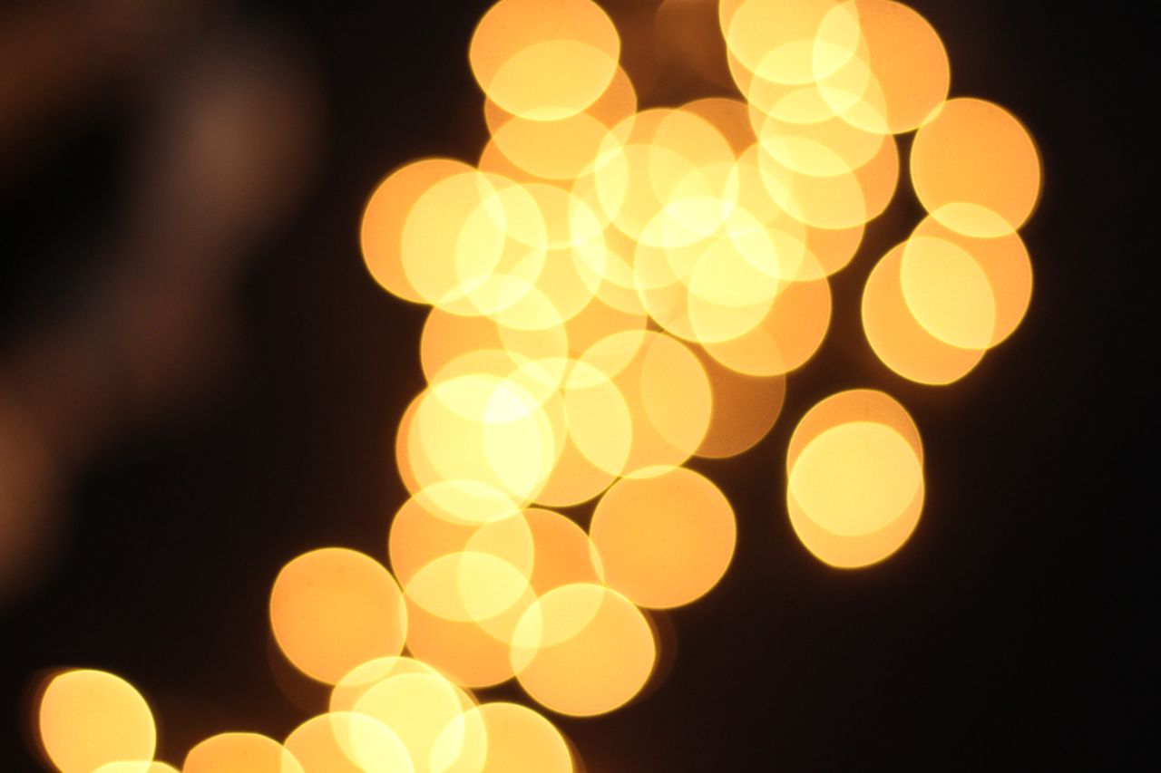 Golden bokeh image of christmas lights