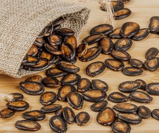 watermelon seeds spilling from hessian bag