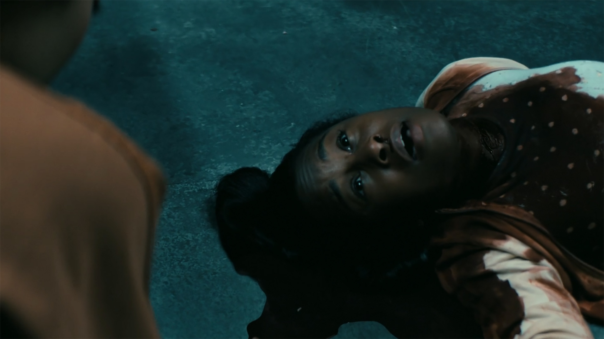 A revived Annabeth gasping for air as she lies on the floor of a jail cell in Gen V season 2 episode 5