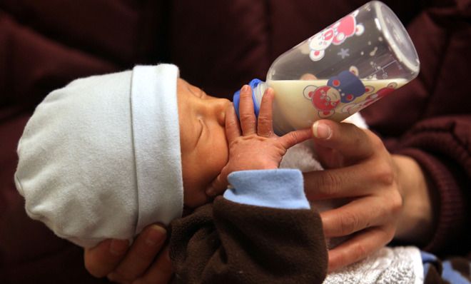 Baby drinking milk from a bottle