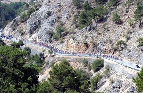 The peloton wind their way up the climb.