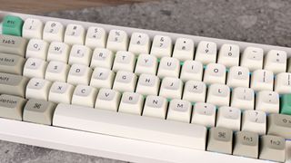 A shell white Keychron Q65 Max wireless mechanical keyboard