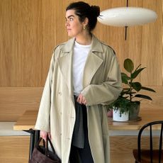 collage of British style influencer Anna Newton posing in chic outfit ideas with elevated basics like a trench coat, white t-shirt, black leggings, and a suede bag