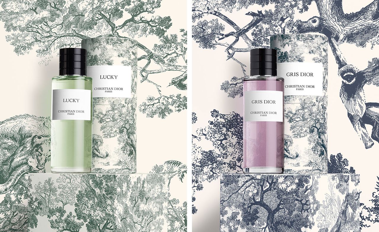 Dior green Lucky fragrance against backdrop of green Toile de Jouy design, Dior purple Gris Dior fragrance against backdrop of blue Toile de Jouy design