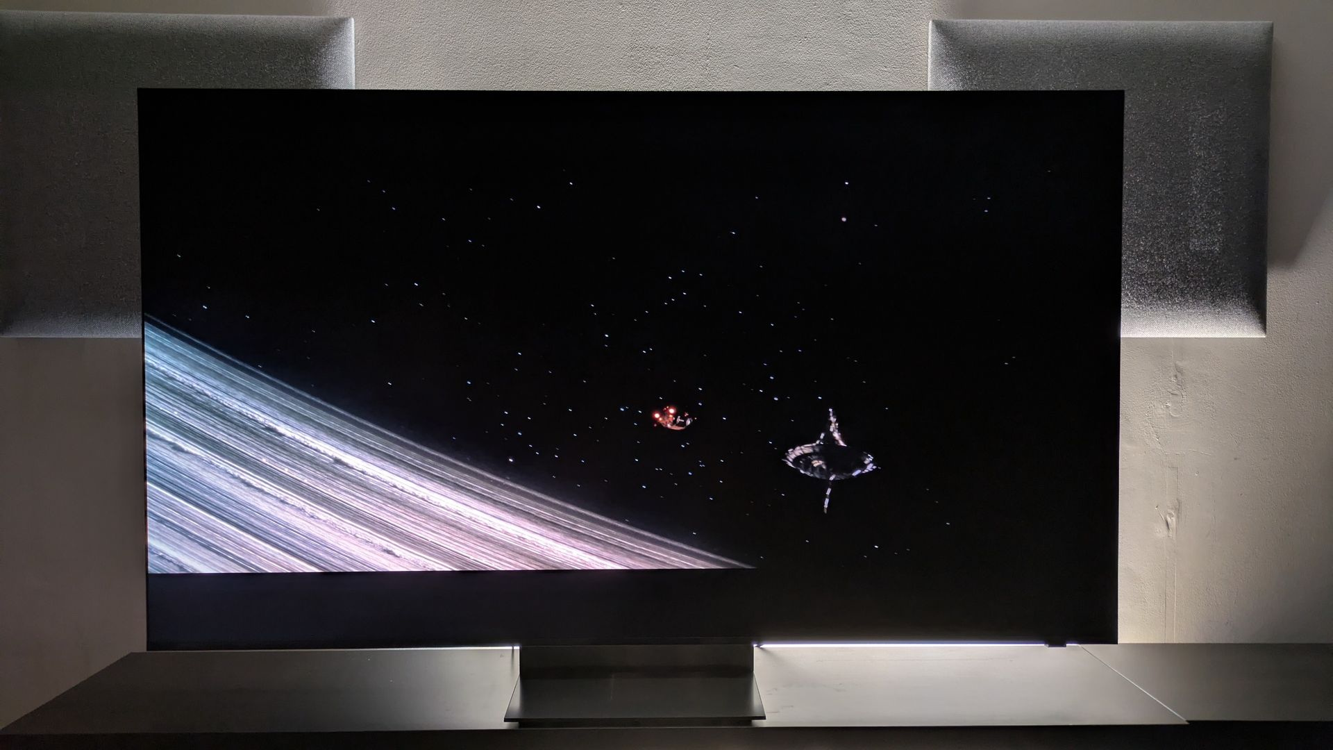 Samsung R95H with shot of space from Aline Romulus on screen. R95H delivers deep black tones