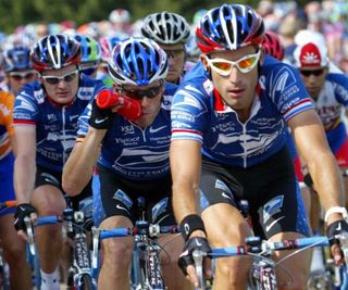 George Hincapie (US Postal) leads team captain Lance Armstrong during the 2002 Tour de France.