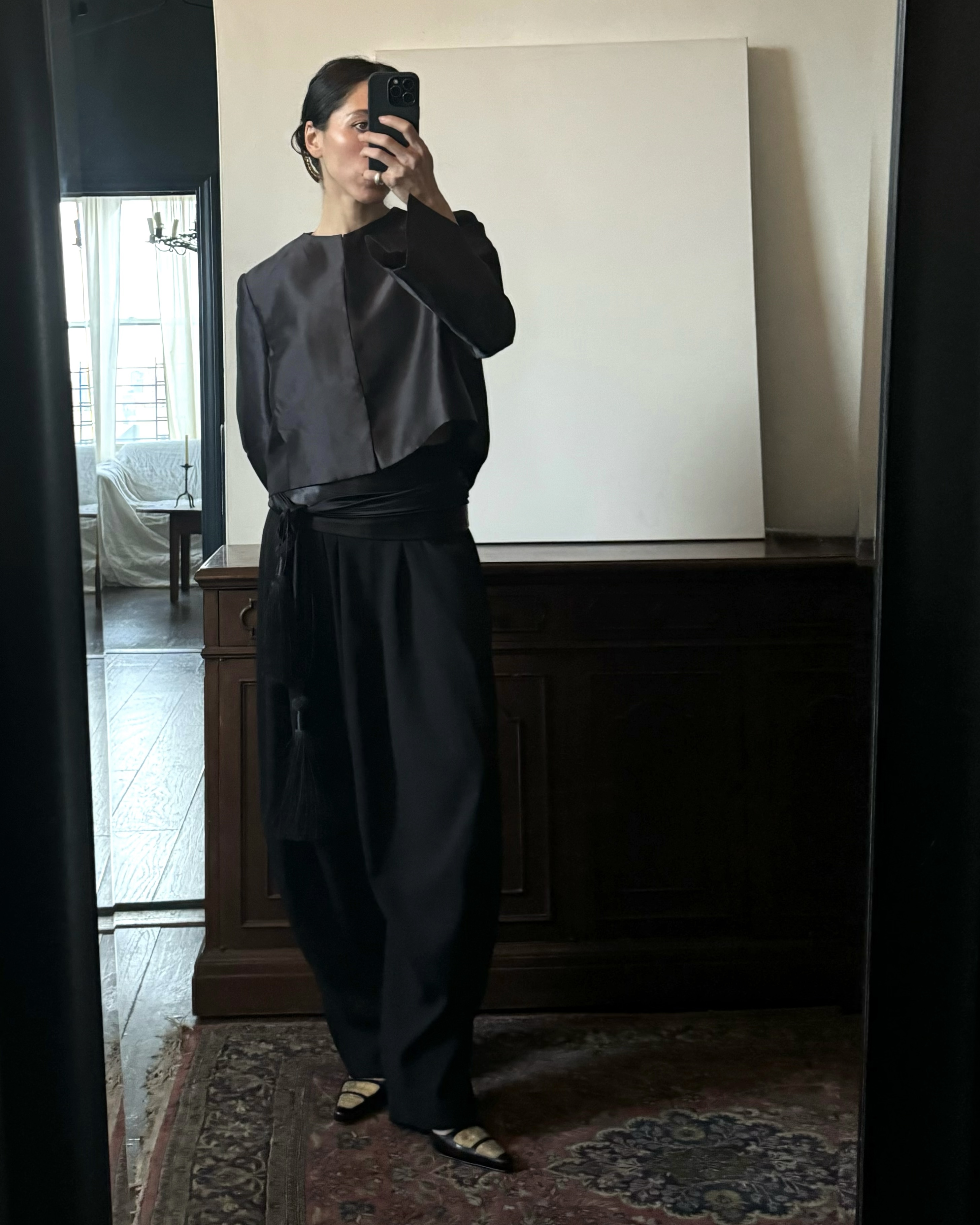 Alexis Badiyi wearing a cropped jacket and black pants