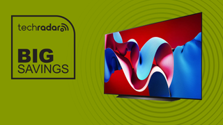 The LG C4 OLED TV next to a sign saying "Big Savings"