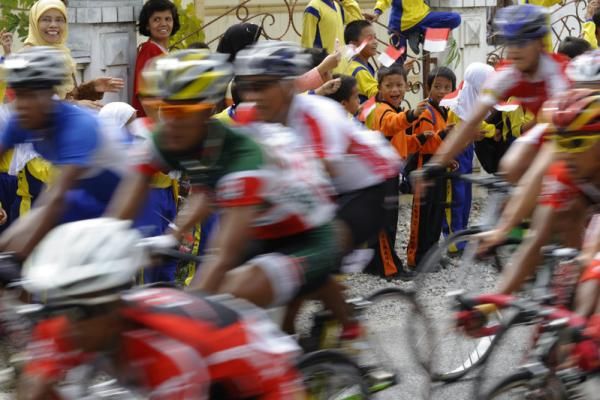 Local Indonesian children cheered for riders