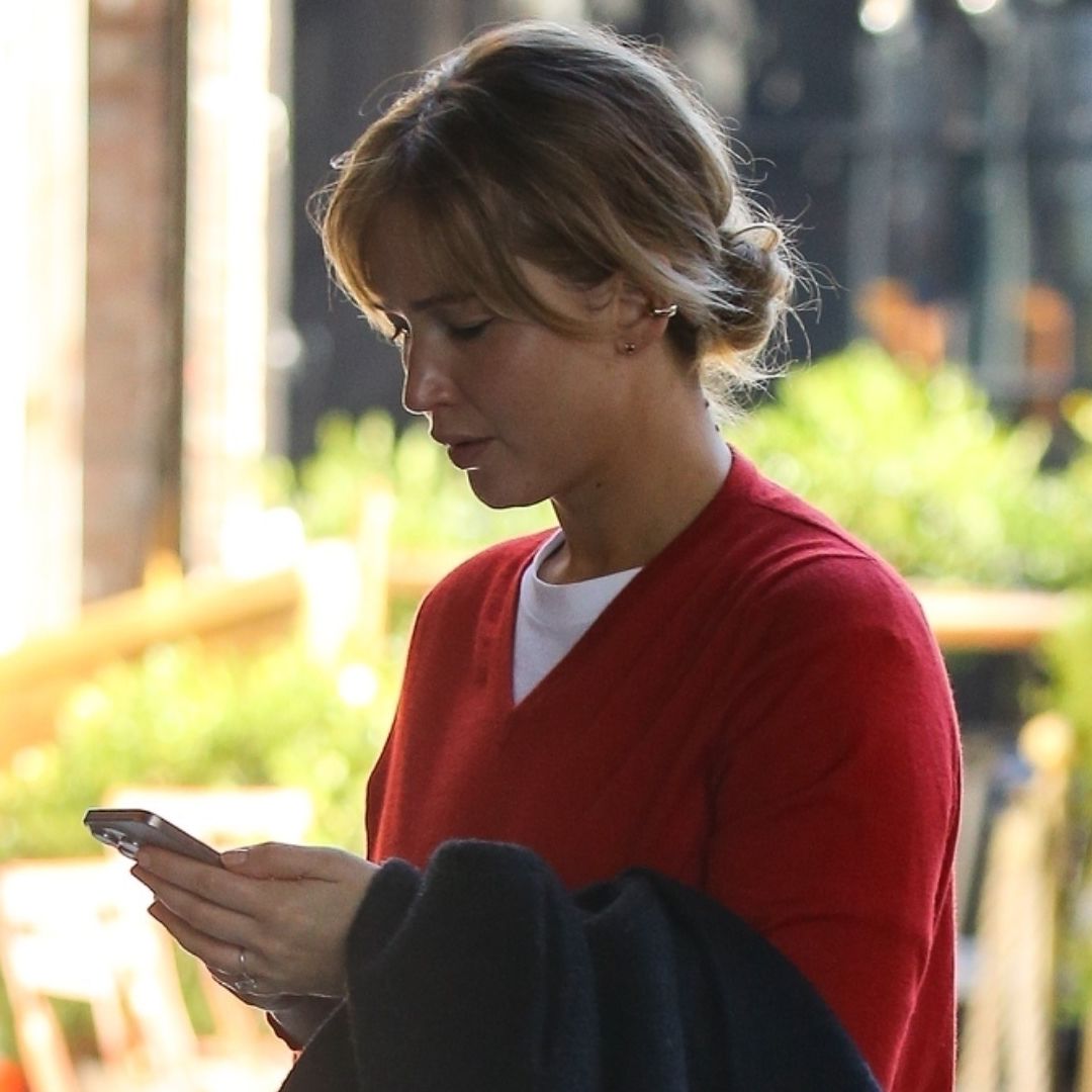 Jennifer Lawrence was spotted in NYC looking every bit a French girl in a red sweater, jeans, and loafers