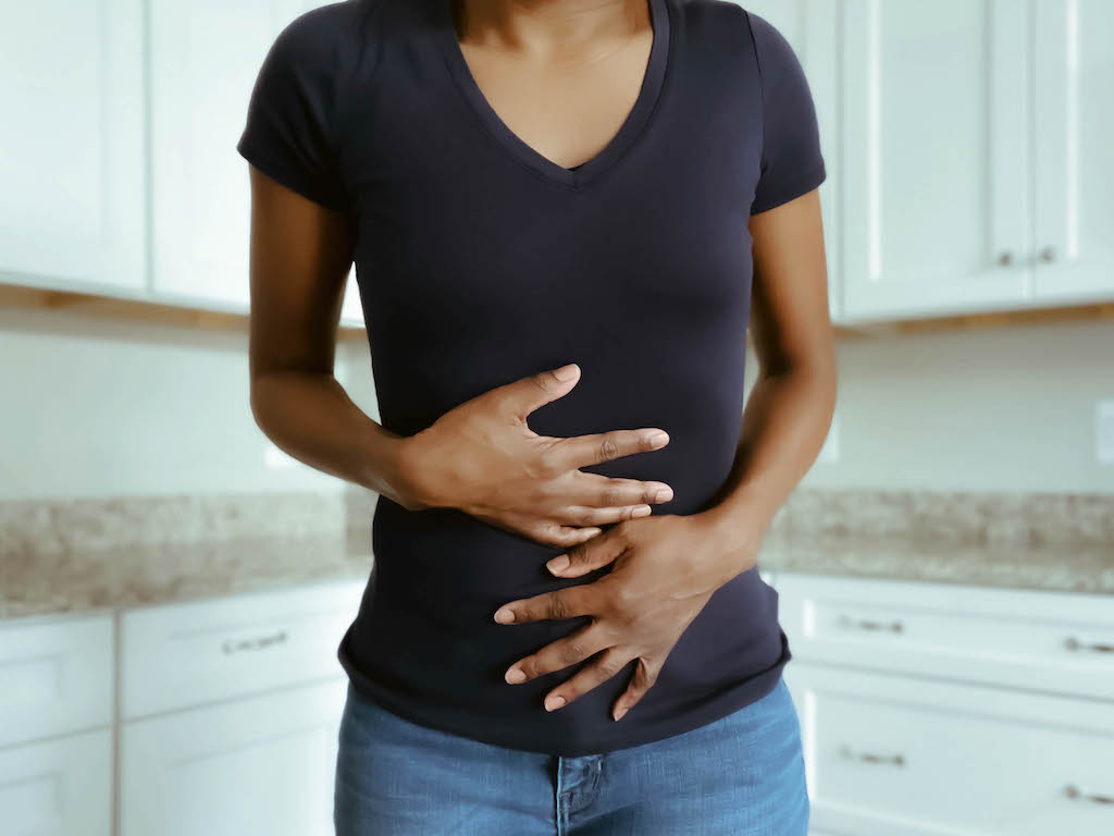 woman holding stomach