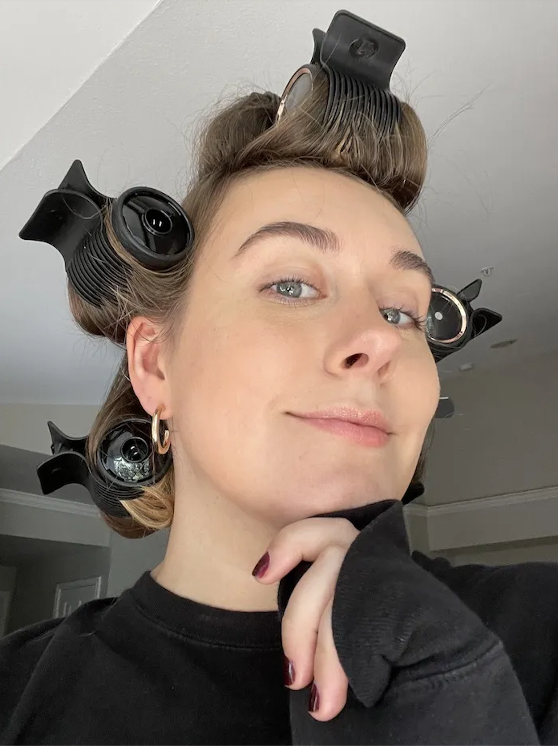 Kaitlyn McLintock wearing hot rollers.
