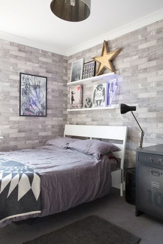How to use exposed brick: grey bedroom scheme with grey brick-effect wallpaper for teenager