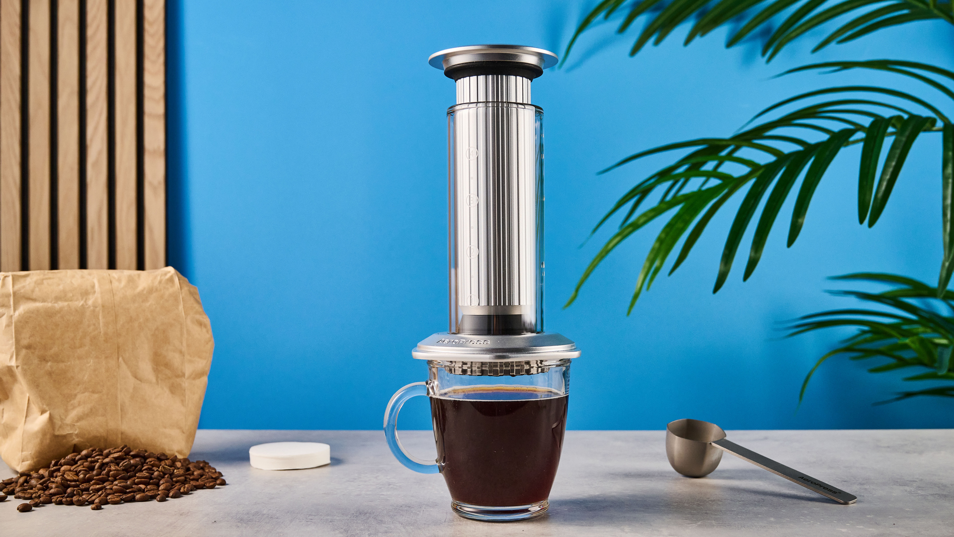 a glass AeroPress premium with aluminum flourishes