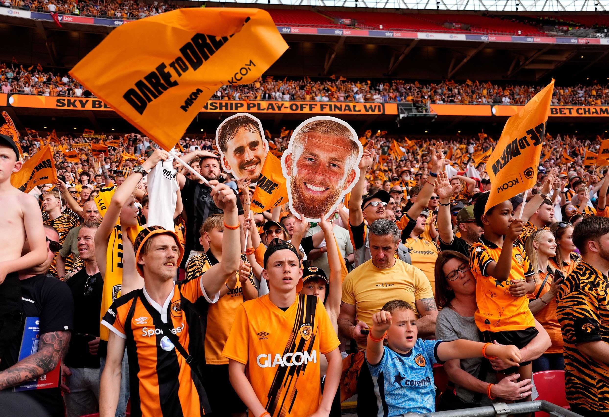 Hull City fans celebrate with a cardboard cut out of Oliver McBurnie after winning promotion to the Premier League following the Sky Bet Championship play-off final against Middlesbrough.