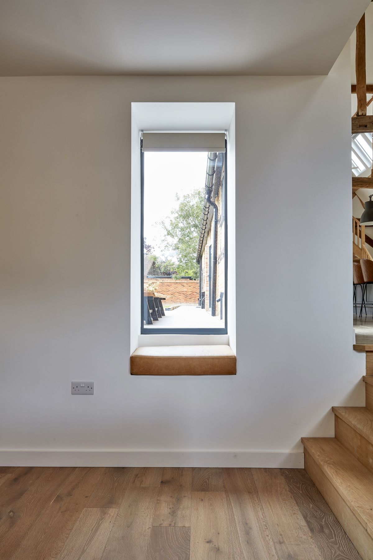 narrow window in white hallway