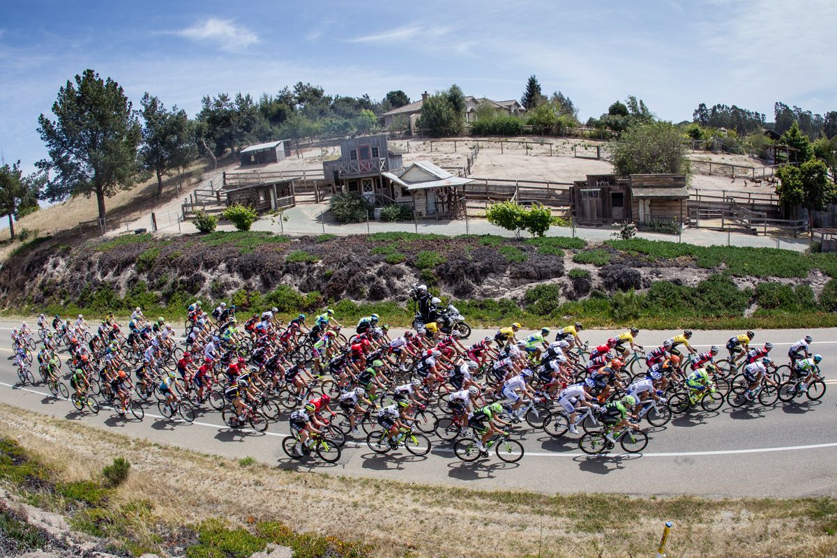 The peloton passes by a mock town during today&rsquo;s stage