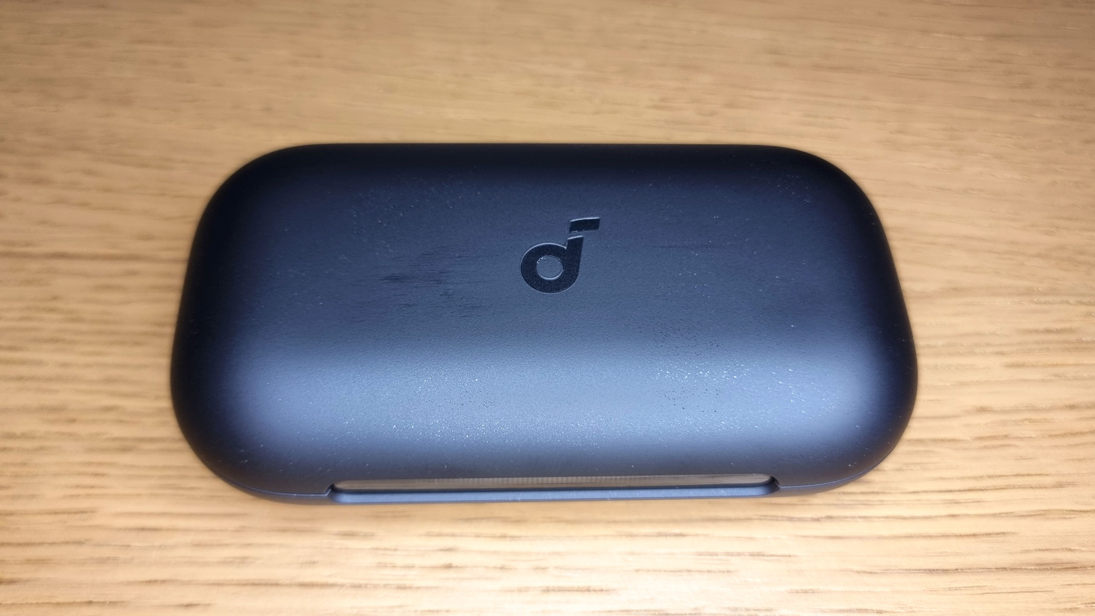 A close-up picture of the charging case for the Soundcore Aerofit 2 Pro