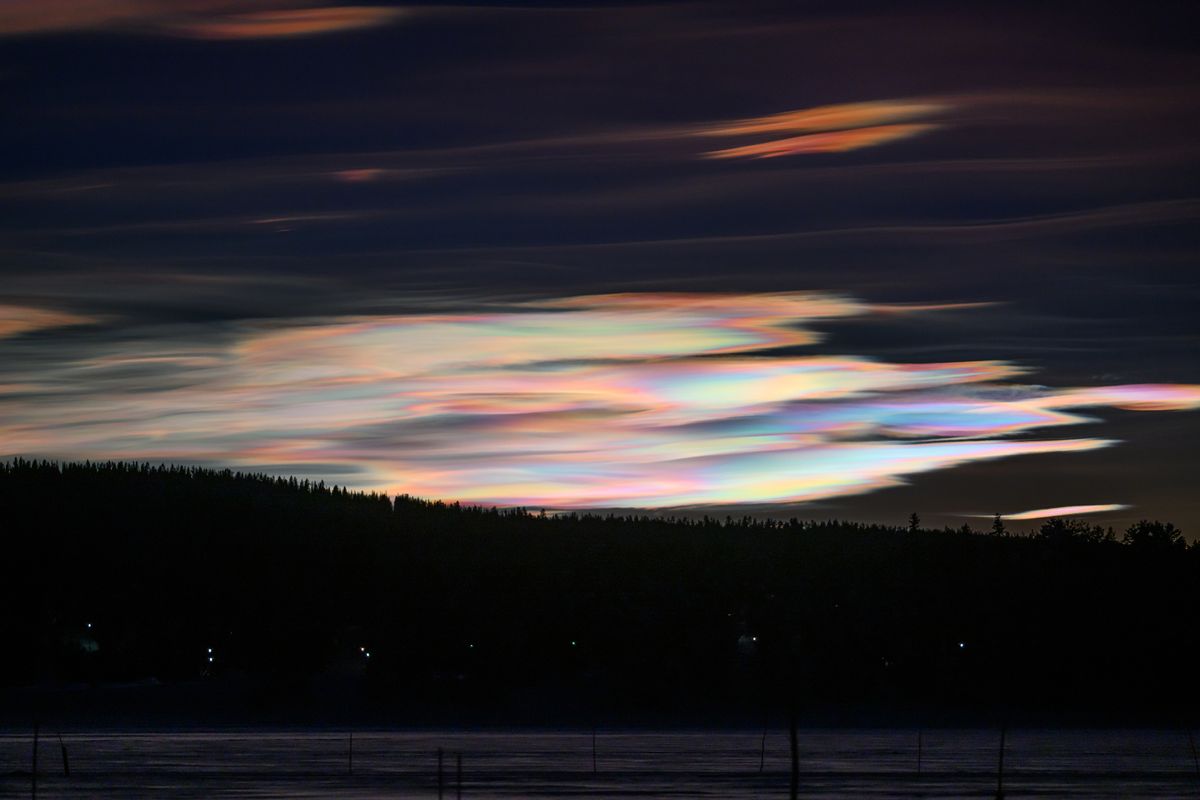 nacreous clouds above ice hotel, Sweden.