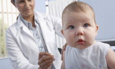 A 5-month-old girl gets a vaccination