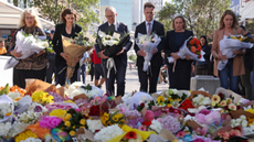 Australia Premier Anthony Albanese and New South Wales Premier Chris Minns lay flowers outside Bondi Junction shopping centre