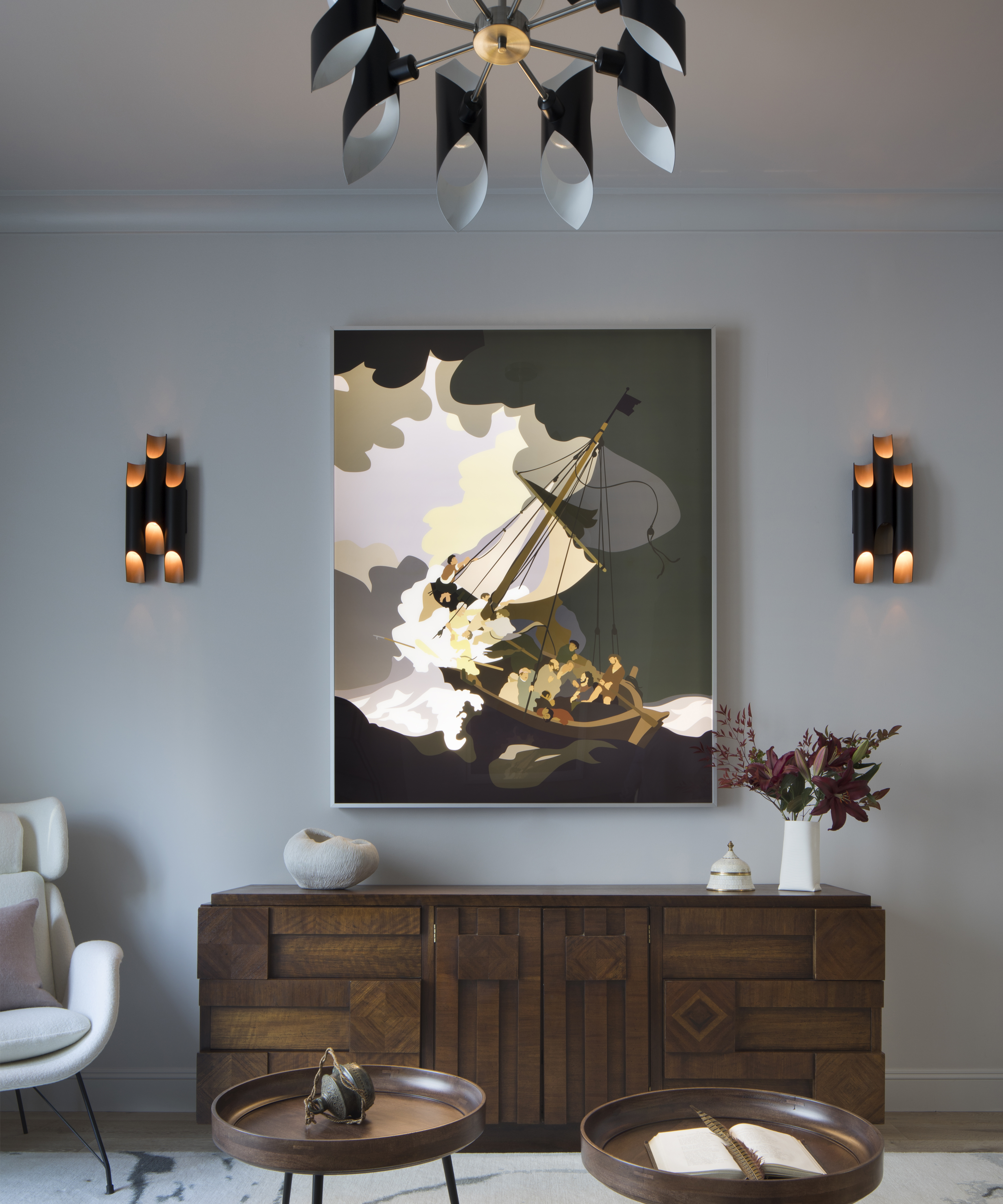 modern art on a gray wall above a cabinet