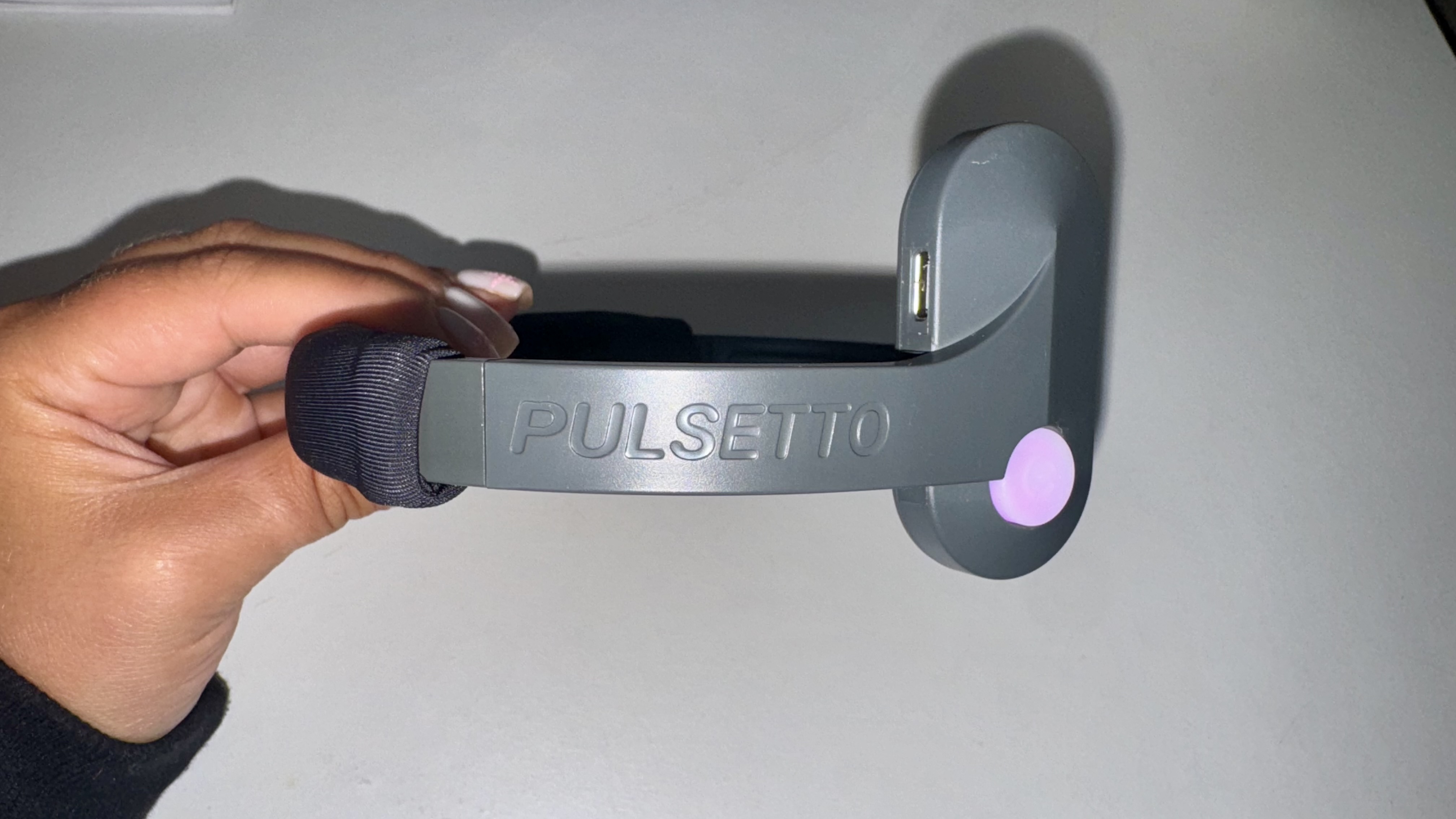 Pulsetto neckband with purple light