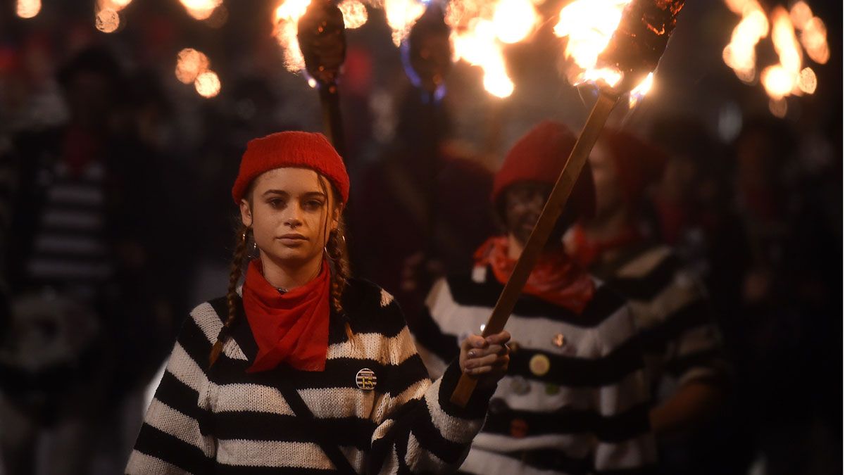 Each of the seven societies has its own colours, motto and costume theme.
