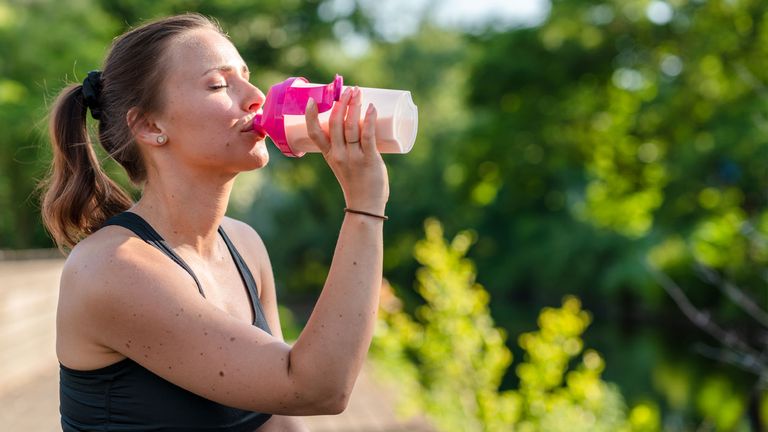 Woman drinking the best protein powder for women